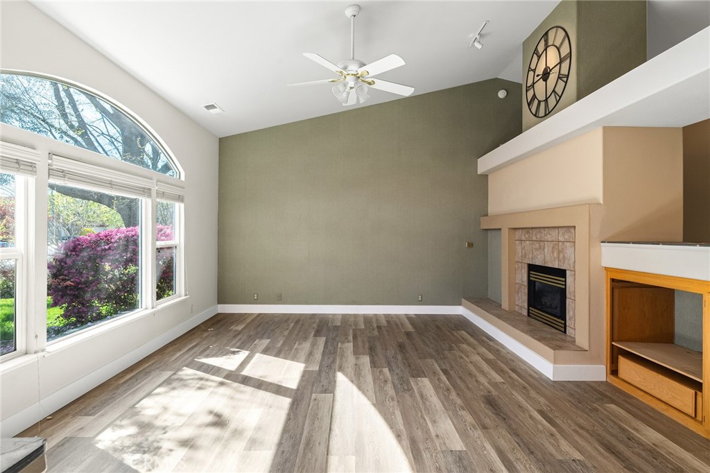 378 Picholine Way Chico, CA 95928 - Photo 6 of 52 a view of empty room with fireplace and wooden floor