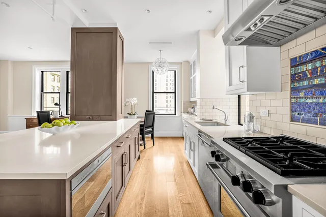 a kitchen with a stove and a sink