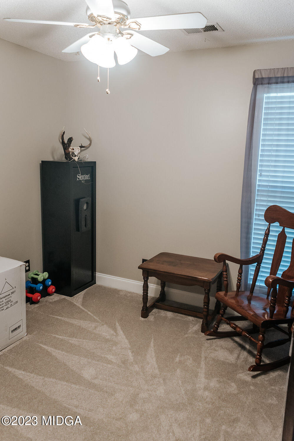1068 Boulder Drive Gray, GA 31032 - Photo 22 of 34 a bedroom with a bed and a chandelier