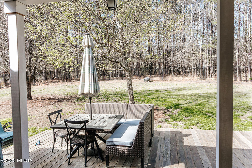 1068 Boulder Drive Gray, GA 31032 - Photo 28 of 34 a view of a city from a dining room with furniture and wooden floor