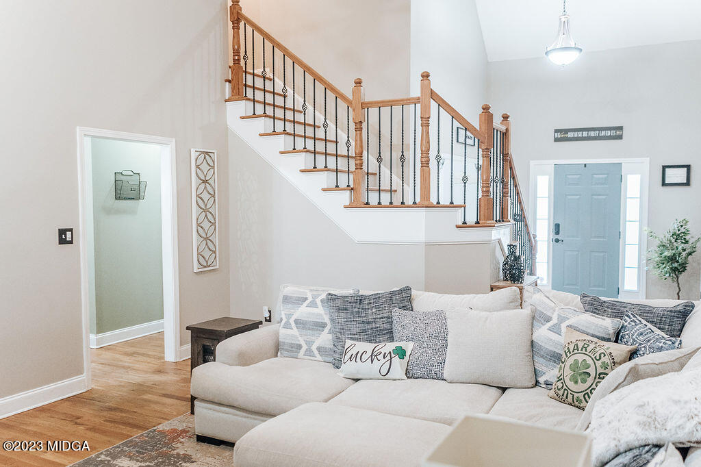 1068 Boulder Drive Gray, GA 31032 - Photo 4 of 34 a living room with furniture or stairs and a couch