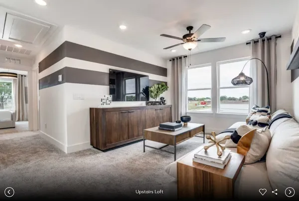 a spacious bedroom with a bed and a large window