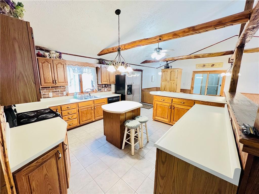 250 Flanigan Road Confluence, PA 15424 - Photo 9 of 44 a large white kitchen with a large window a sink and a counter top space