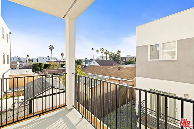 a view of a balcony with city view
