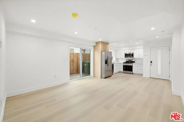 a view of an empty room with a stove
