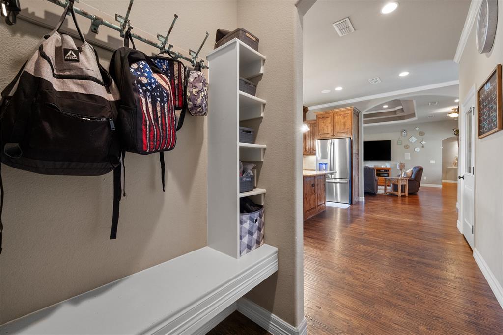 606 Sunset Point Kerens, TX 75144 - Photo 13 of 39 a view of a living room and a hallway with wooden floor