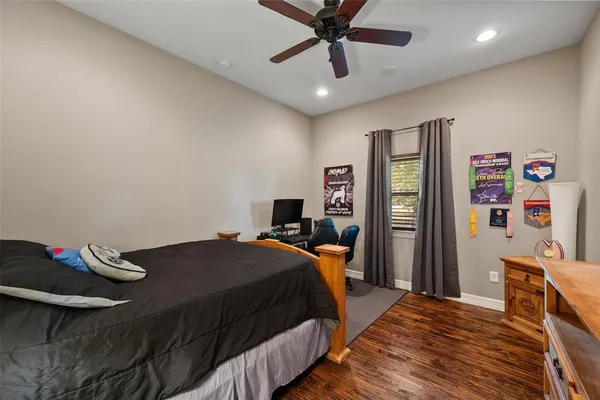 a bedroom with a bed and a book shelf