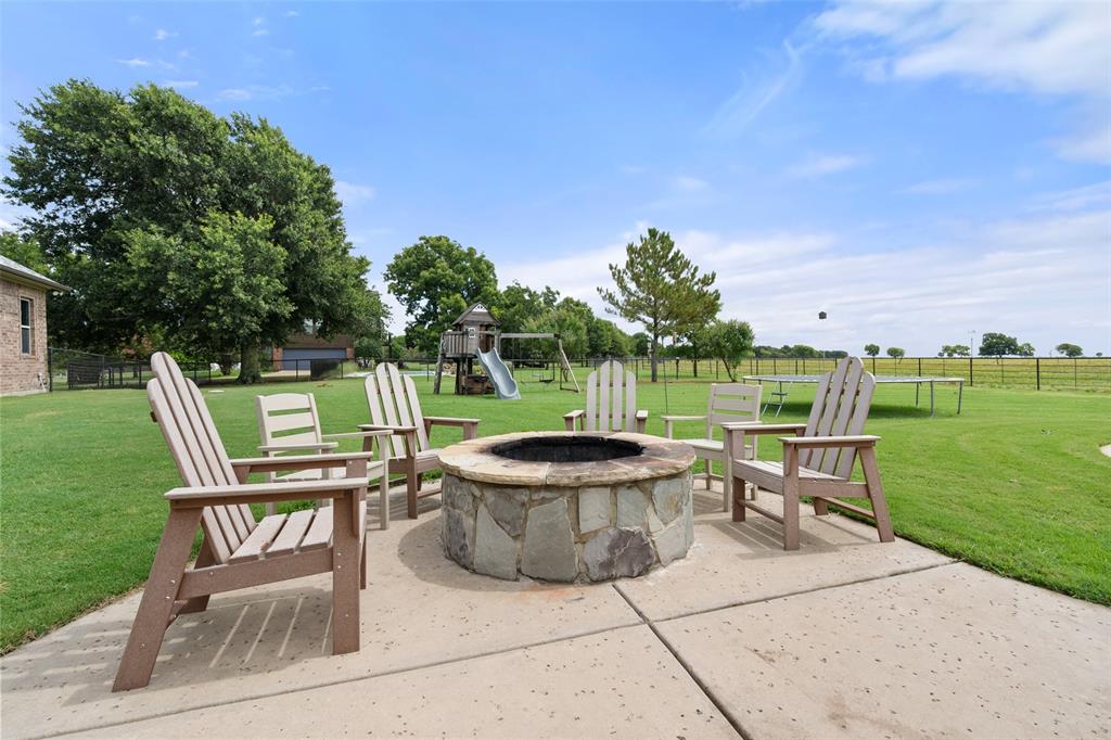 606 Sunset Point Kerens, TX 75144 - Photo 33 of 39 a view of a chair and table on the terrace