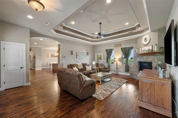 a living room with furniture and a fireplace