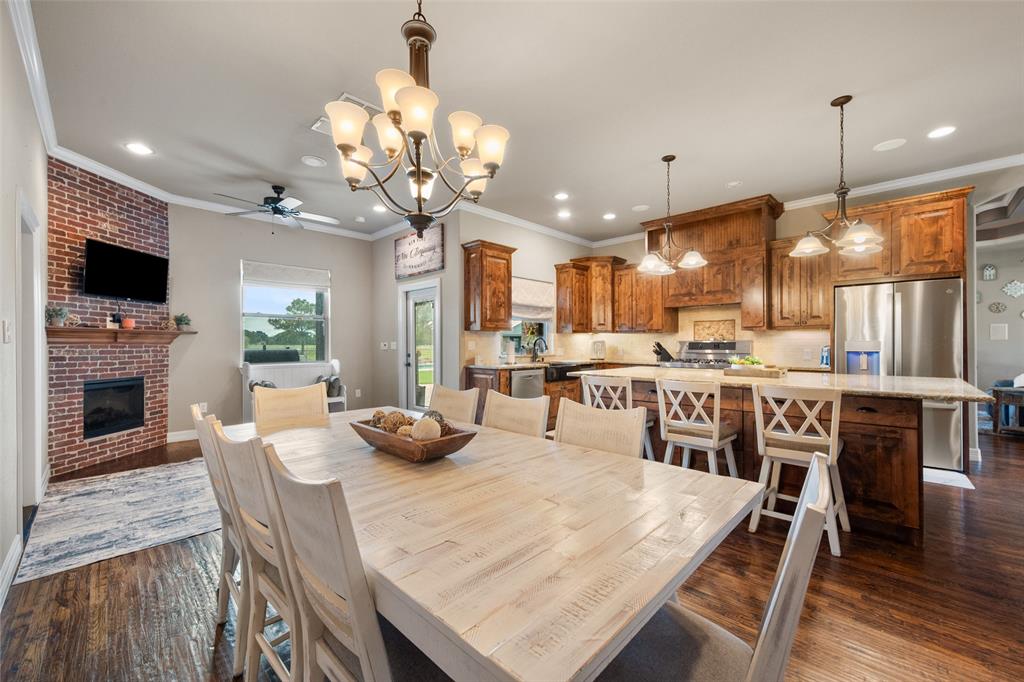 606 Sunset Point Kerens, TX 75144 - Photo 10 of 39 a large kitchen with a table and chairs