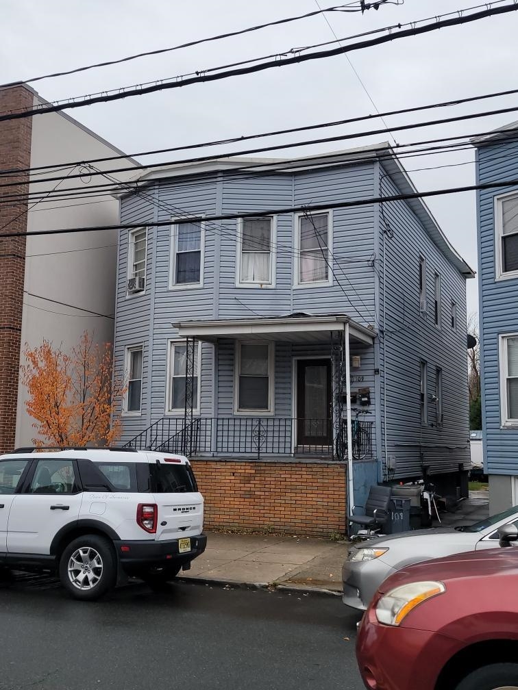 a front view of a house with parking space