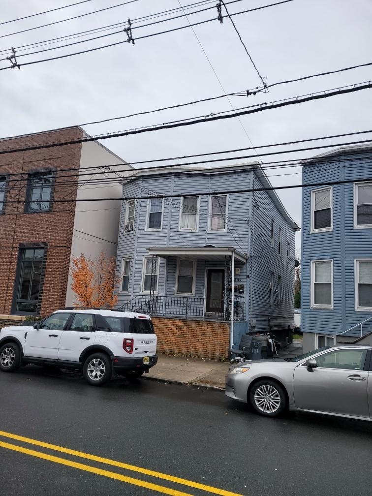 109 Centre Avenue, Unit FIRST Secaucus, NJ 07094 - Photo 19 of 19 a car parked in front of a building