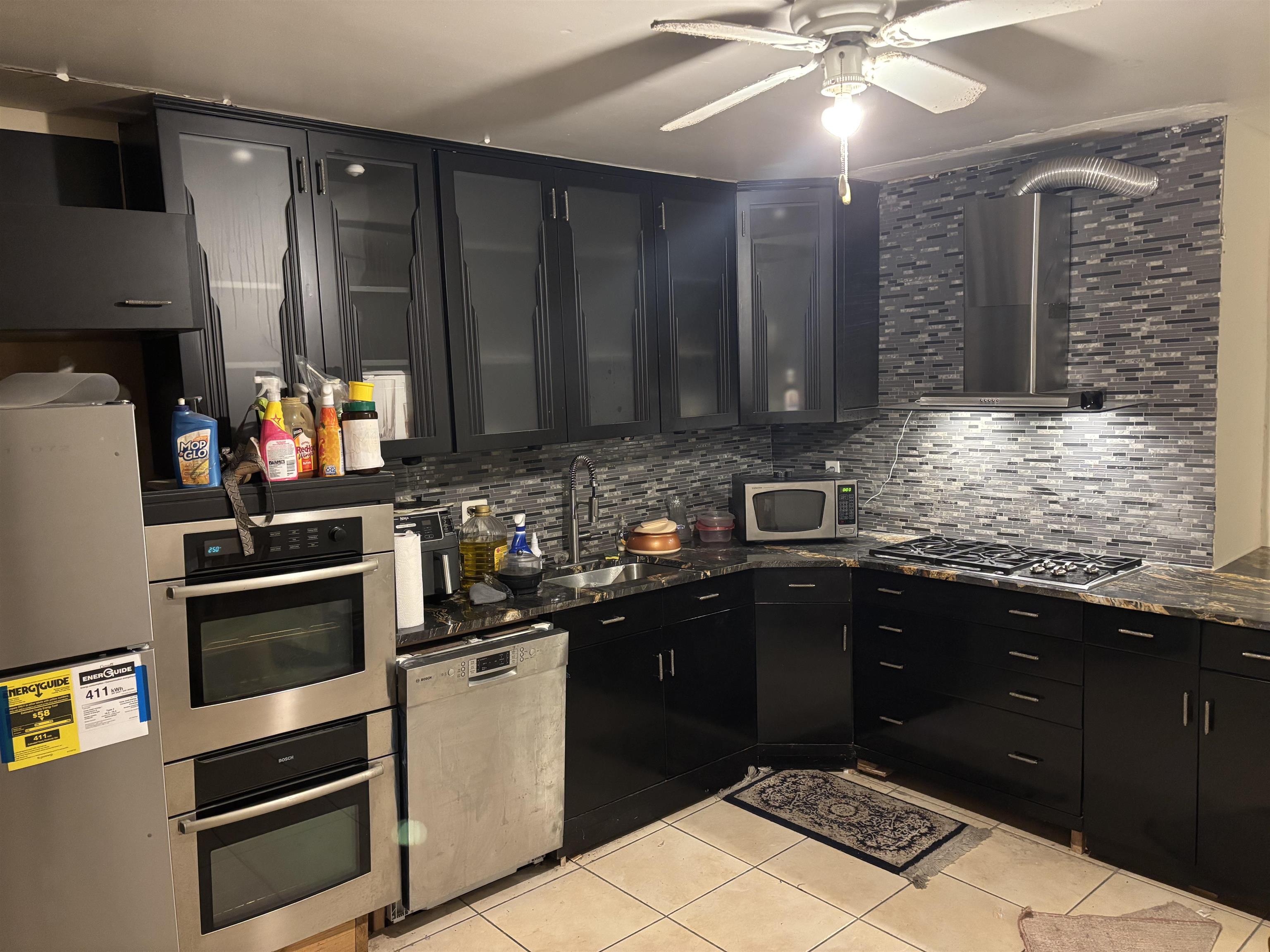 109 Centre Avenue, Unit FIRST Secaucus, NJ 07094 - Photo 5 of 19 a kitchen with a sink cabinets and window
