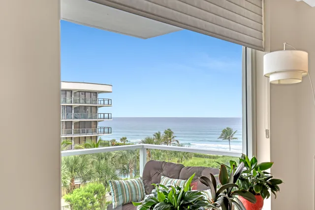 a view of balcony with furniture