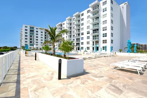 a view of swimming pool with outdoor seating