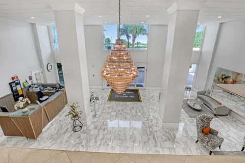 a living room with furniture and a book shelf