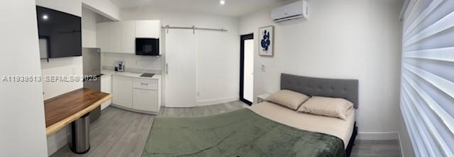 910 Southwest 8th Avenue, Unit B Miami, FL 33130 - Photo 2 of 7 a living room with furniture and a flat screen tv