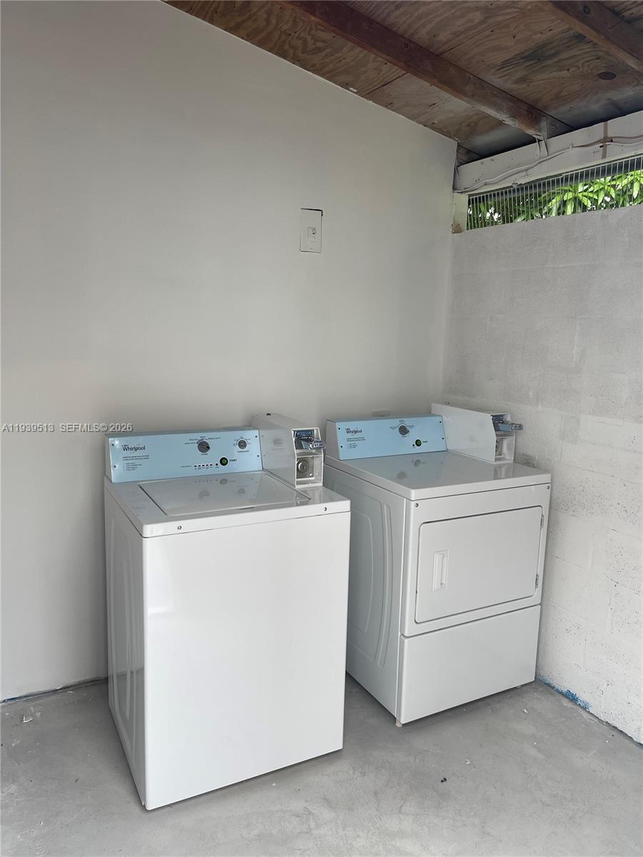 910 Southwest 8th Avenue, Unit B Miami, FL 33130 - Photo 7 of 7 a utility room with dryer and washer