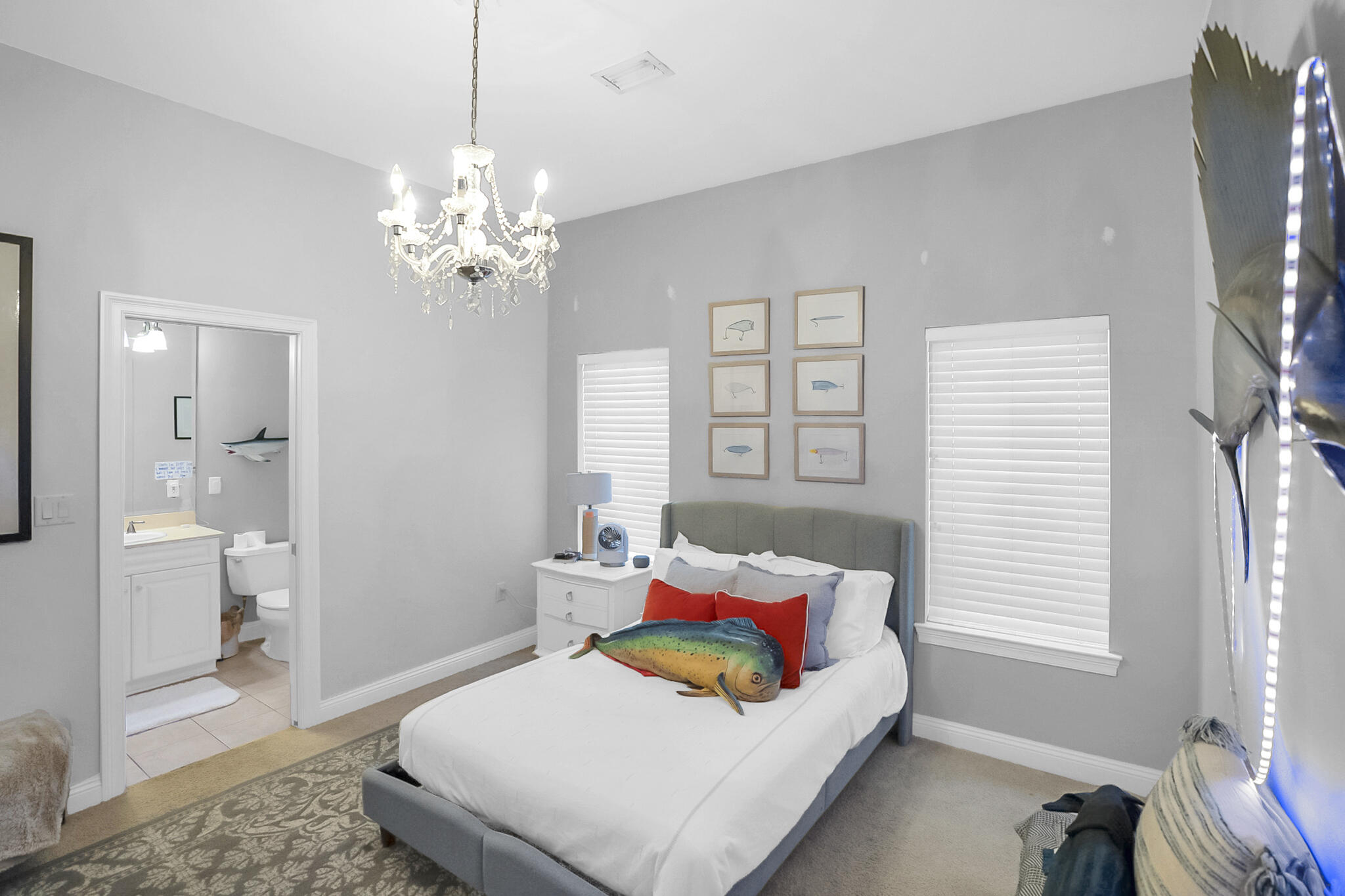 4372 Stonebridge Road Destin, FL 32541 - Photo 37 of 83 a bedroom with a bed and a chandelier