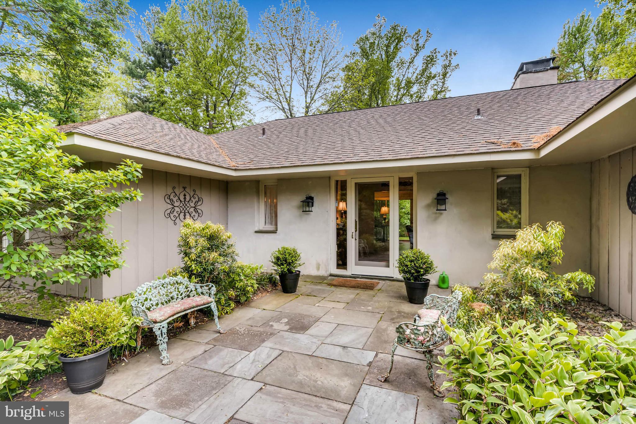 a front view of a house with garden