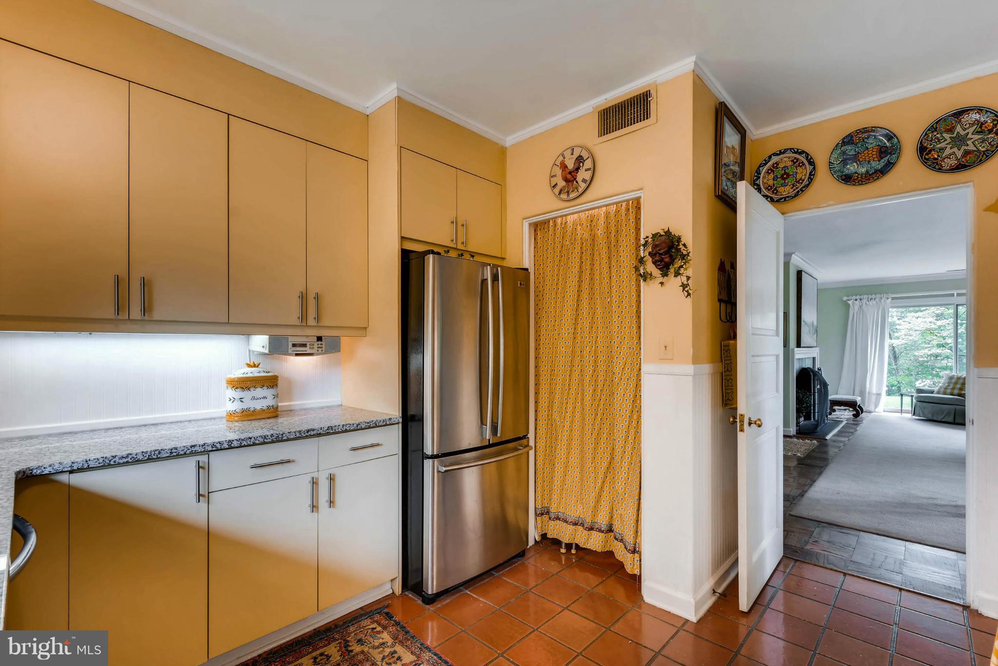 1020 St Georges Road Baltimore, MD 21210 - Photo 11 of 30 a kitchen with stainless steel appliances a refrigerator and cabinets