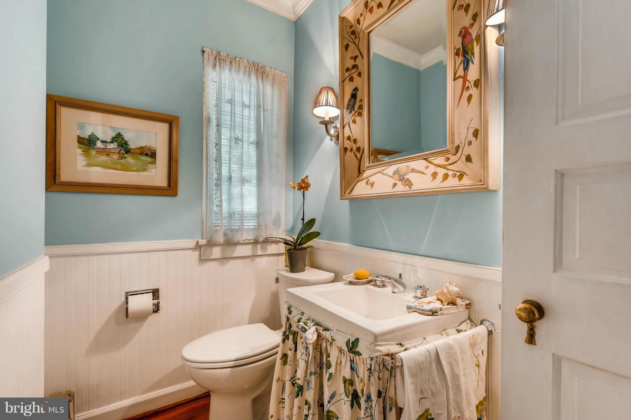 1020 St Georges Road Baltimore, MD 21210 - Photo 20 of 30 a bathroom with a sink toilet and mirror