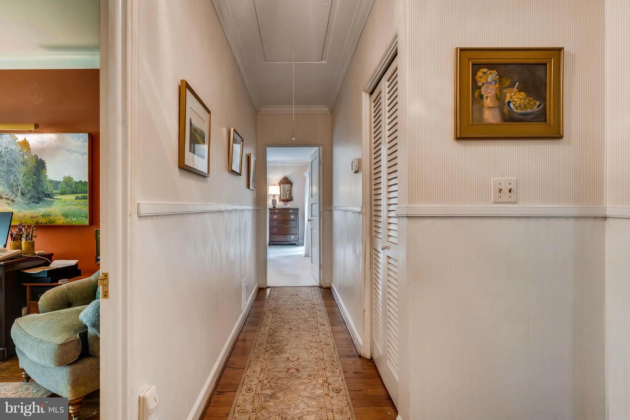 1020 St Georges Road Baltimore, MD 21210 - Photo 21 of 30 a hallway with front door wooden floor and windows
