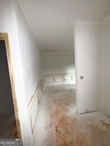 a large white bed in a white room