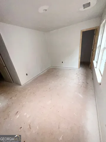 an empty room with windows