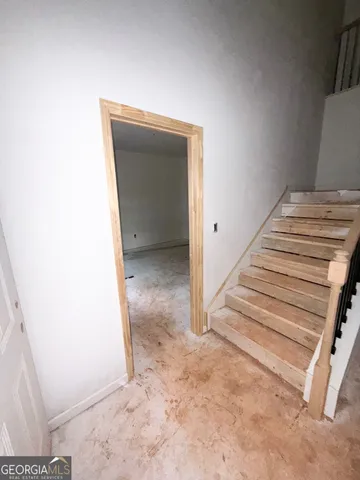 a view of a hallway with staircase