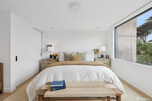a bathroom with a granite countertop toilet sink and shower