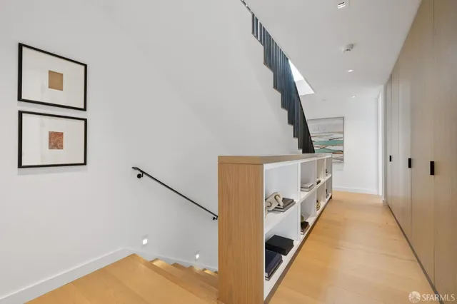 a living room with furniture fireplace and a table