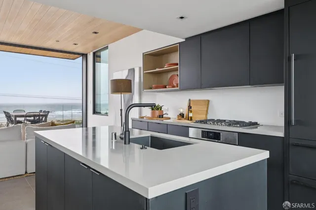 a kitchen with a stove and cabinets