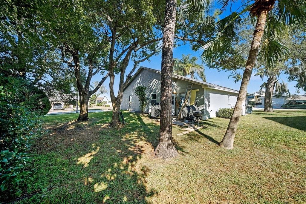 13749 Meade Court Hudson, FL 34667 - Photo 31 of 33 a view of a park with swings and slides