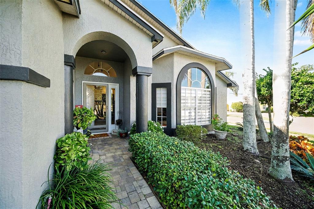13749 Meade Court Hudson, FL 34667 - Photo 6 of 33 a front view of a house with garden