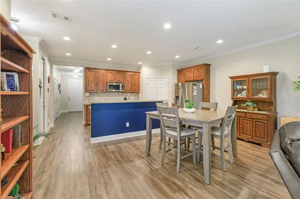 a kitchen with a table and chairs in it