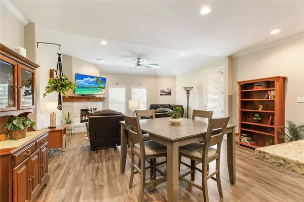 a view of a dining room with furniture and a wooden floor