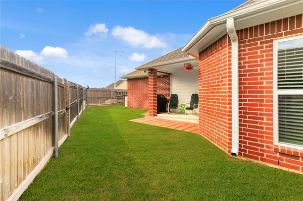 a view of a backyard with potted plants