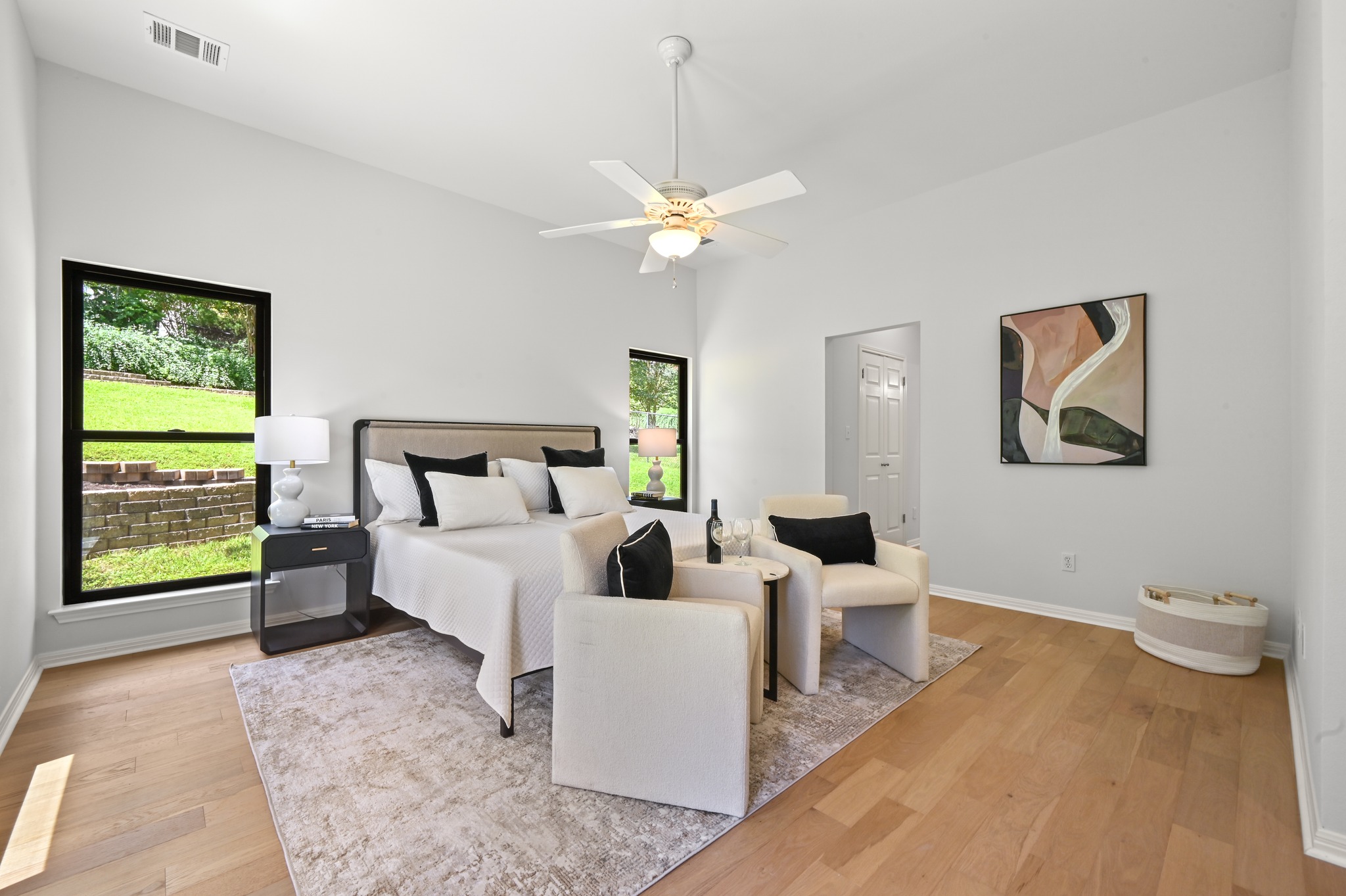 1107 Bowie Road Austin, TX 78733 - Photo 18 of 40 Hardwood floors and vaulted ceilings elevate this comfortable bedroom.