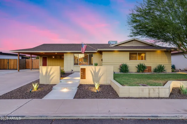 a front view of a house with a yard