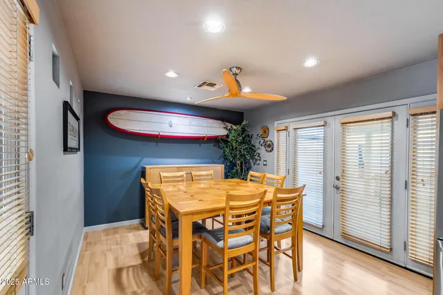 a living room with stainless steel appliances kitchen island granite countertop furniture and a kitchen view