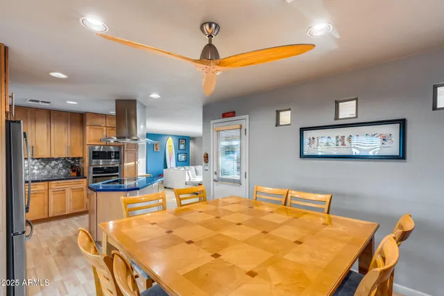a kitchen with stainless steel appliances a sink and cabinets
