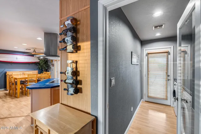 a bedroom with a bed and a view of kitchen