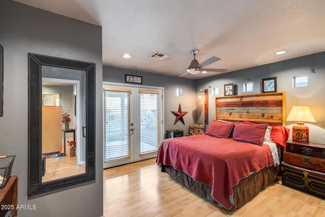 a bathroom with a granite countertop sink a toilet and shower