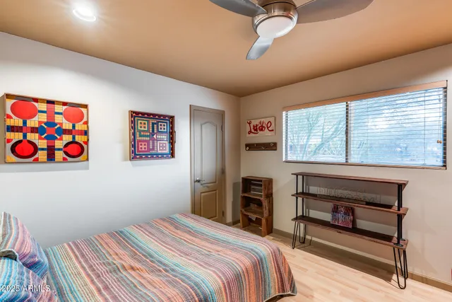 a view of a room with shelves and wooden floor
