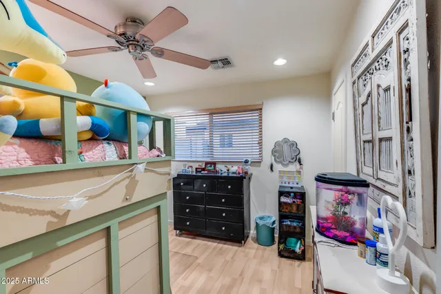 a view of a patio with a dining table and chairs with wooden floor