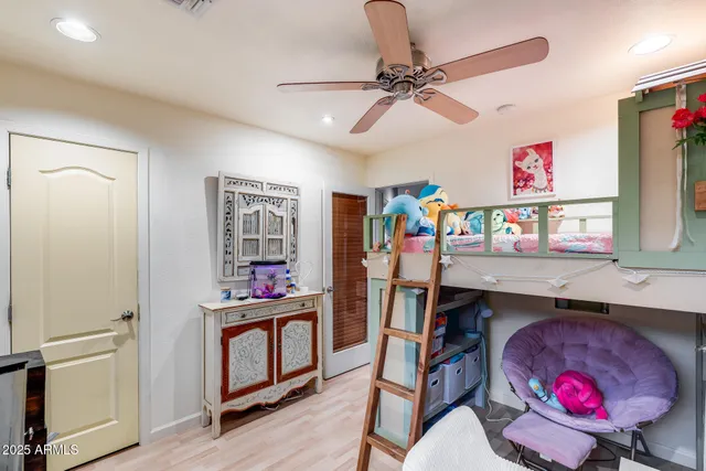 a view of a patio with table and chairs potted plants with wooden floor and fence