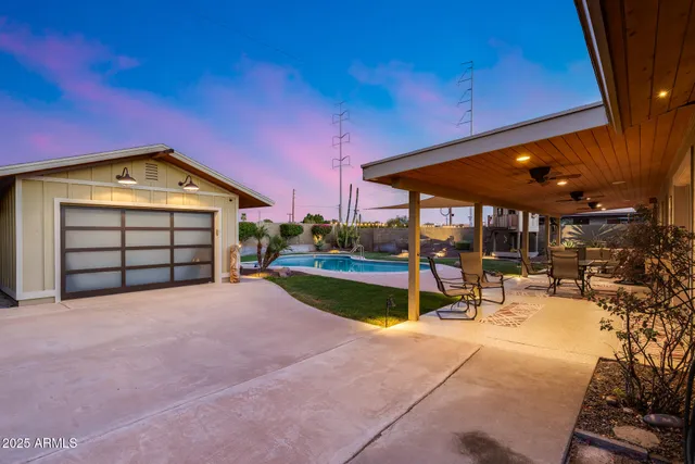 a outdoor space with the couches and kitchen view