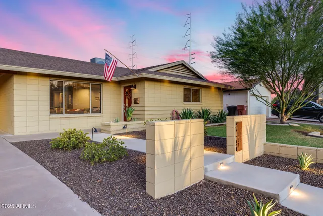 a front view of a house with garden