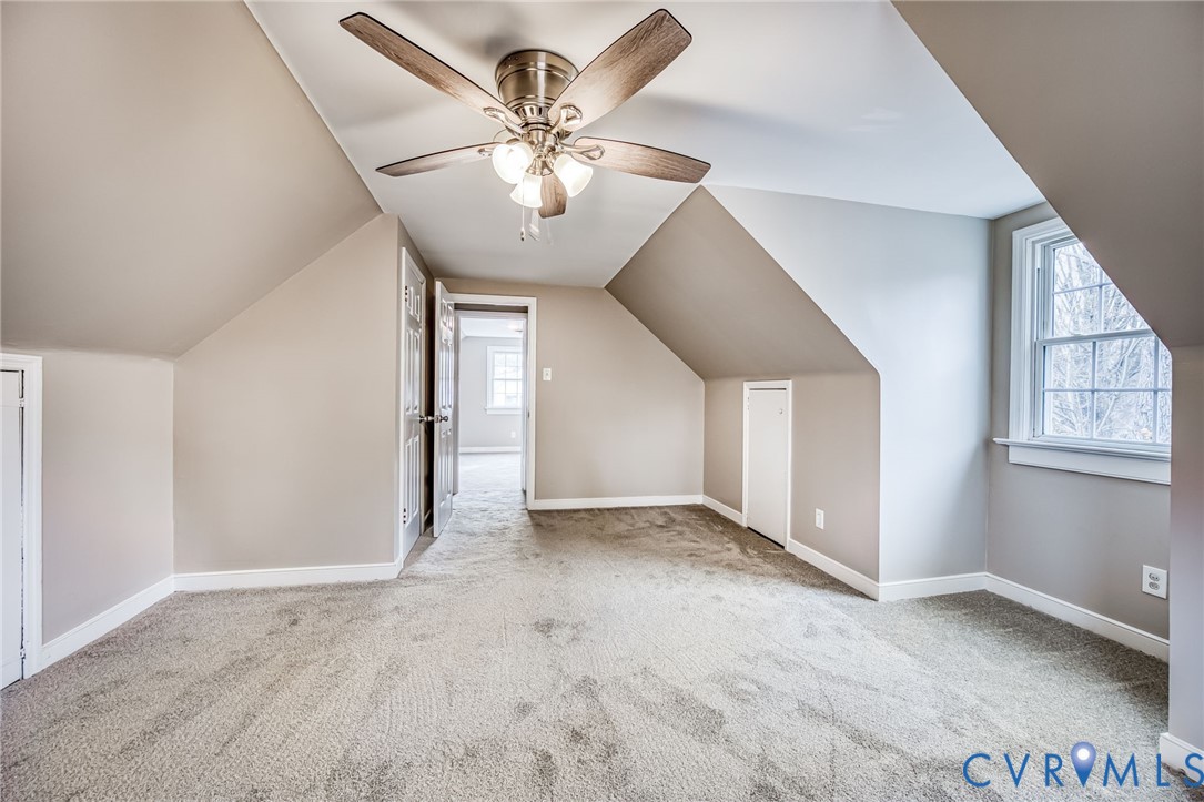 1221 Santa Anna Road Henrico, VA 23229 - Photo 19 of 26 Additional living space with light carpet, vaulted